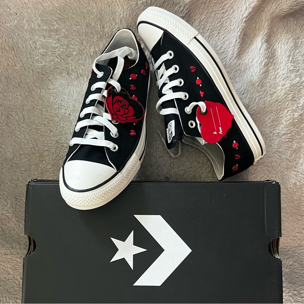 Converse with broken hearts and roses